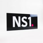 Glossy black, back-painted sign for NS1, a San Francisco based company that manages DNS and traffic technologies.