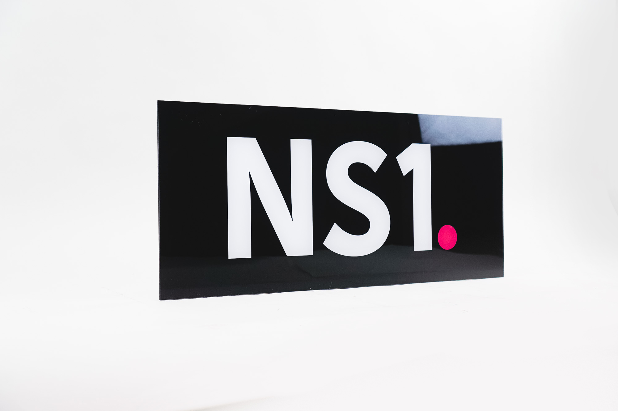 Glossy black, back-painted sign for NS1, a San Francisco based company that manages DNS and traffic technologies. Glossy black, back-painted sign for NS1, a San Francisco based company that manages DNS and traffic technologies.