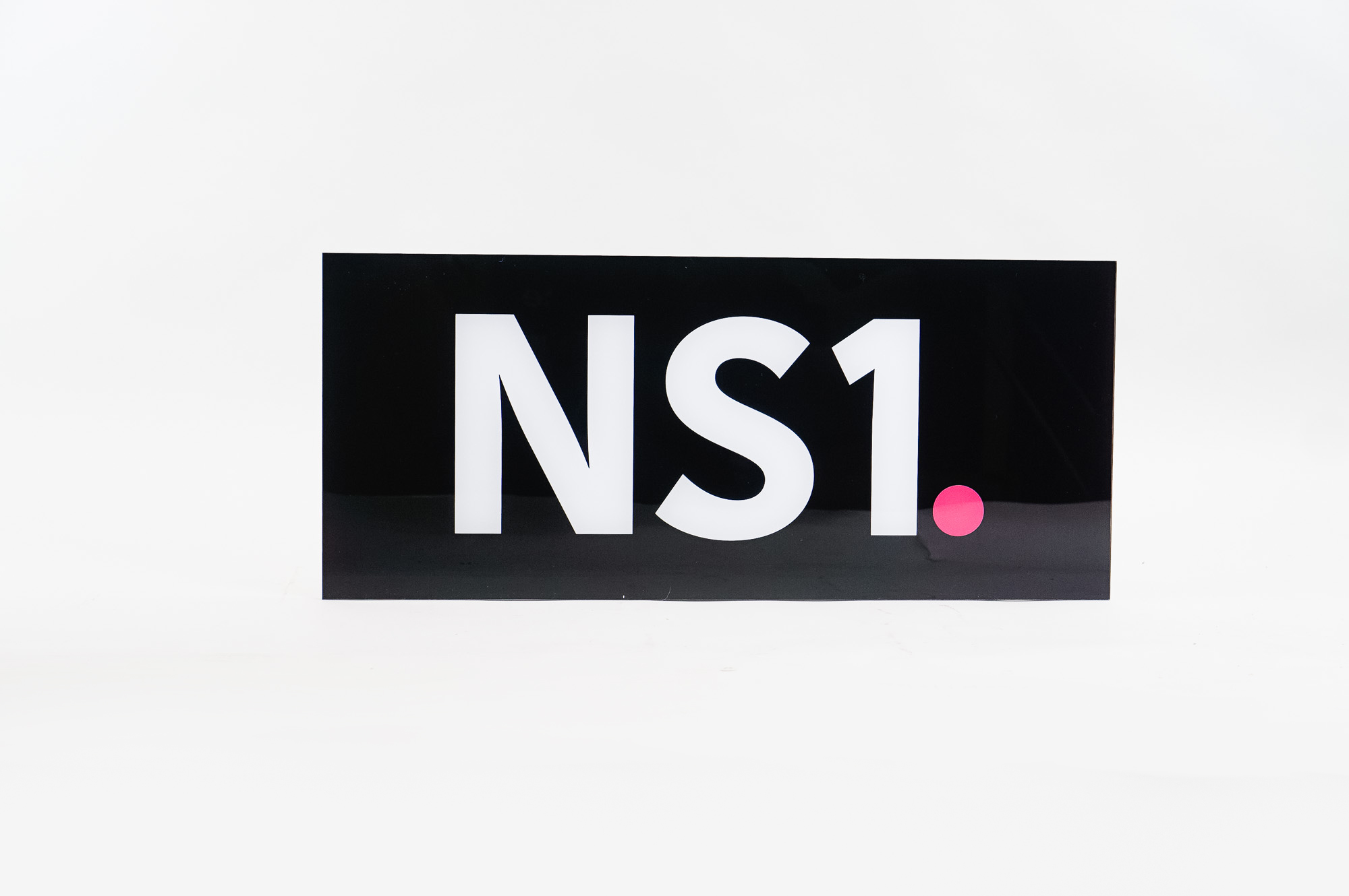 Glossy black, back-painted sign for NS1, a San Francisco based company that manages DNS and traffic technologies. Glossy black, back-painted sign for NS1, a San Francisco based company that manages DNS and traffic technologies.