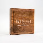 Solid walnut retail/cafe sign with white artwork for RIshi, a Direct Trade importer of organic teas and botanicals from the very best sources.