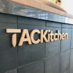 Wood letters on front counter at the cafeteria/kitchen of Thumbtack, an online service that matches customers with local professionals.