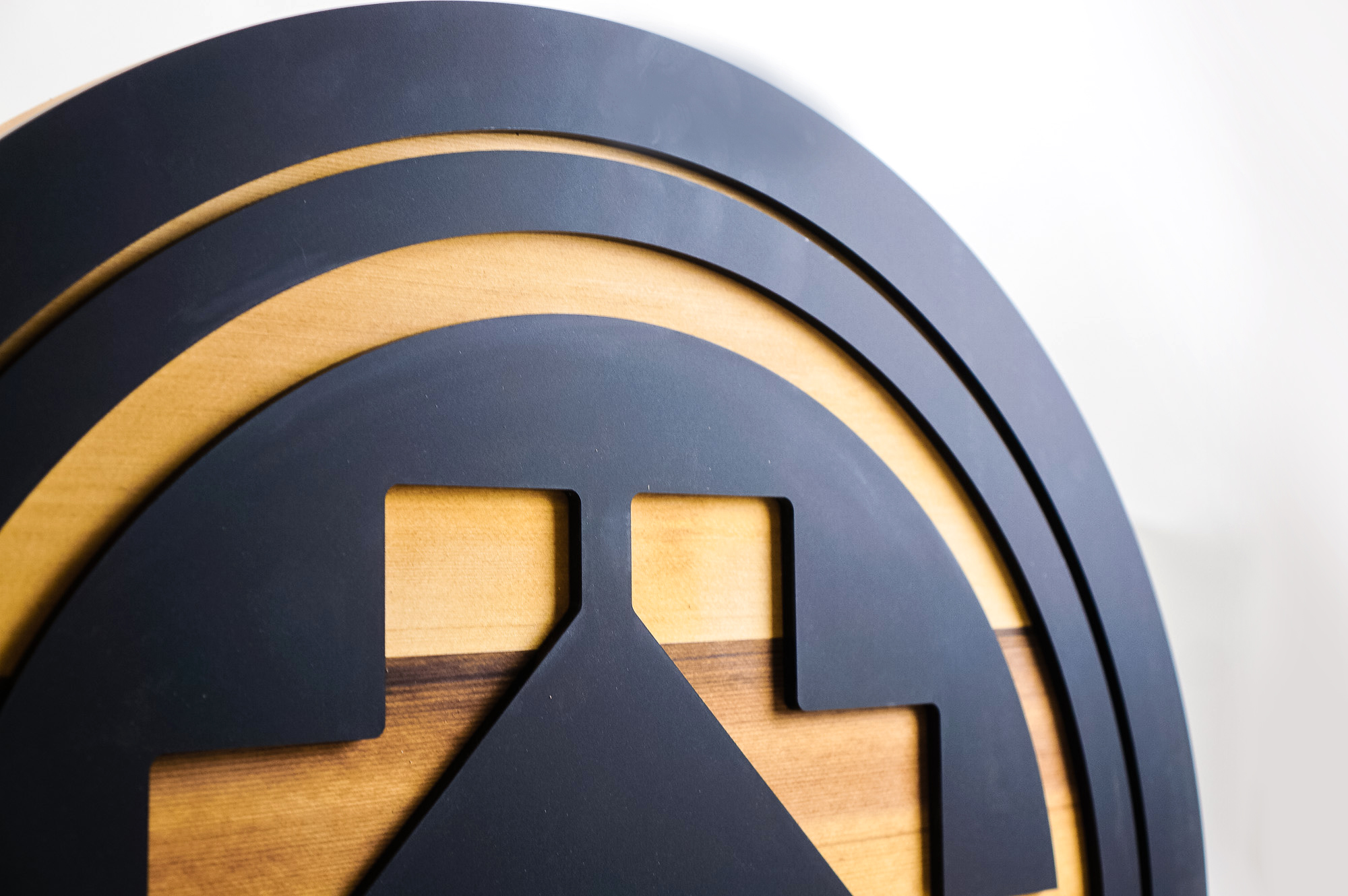 Raised matte black and cedar round exterior sign for BEMO, a Los Angeles based creative studio specializing in VFX, Animation and Immersive Content. Raised matte black and cedar round exterior sign for BEMO, a Los Angeles based creative studio specializing in VFX, Animation and Immersive Content.