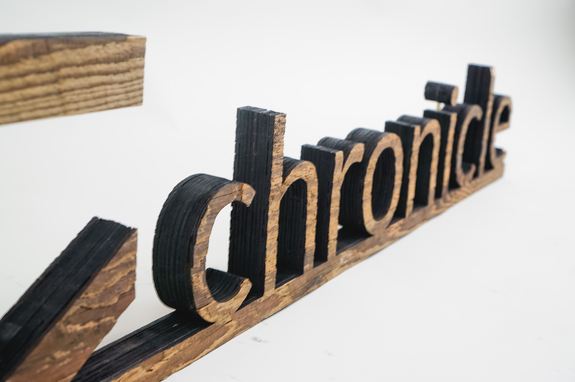 Rustic wood freestanding tabletop logo and letters for a sales conference for Chronicle Security, a cybersecurity company based in Mountain View, California.