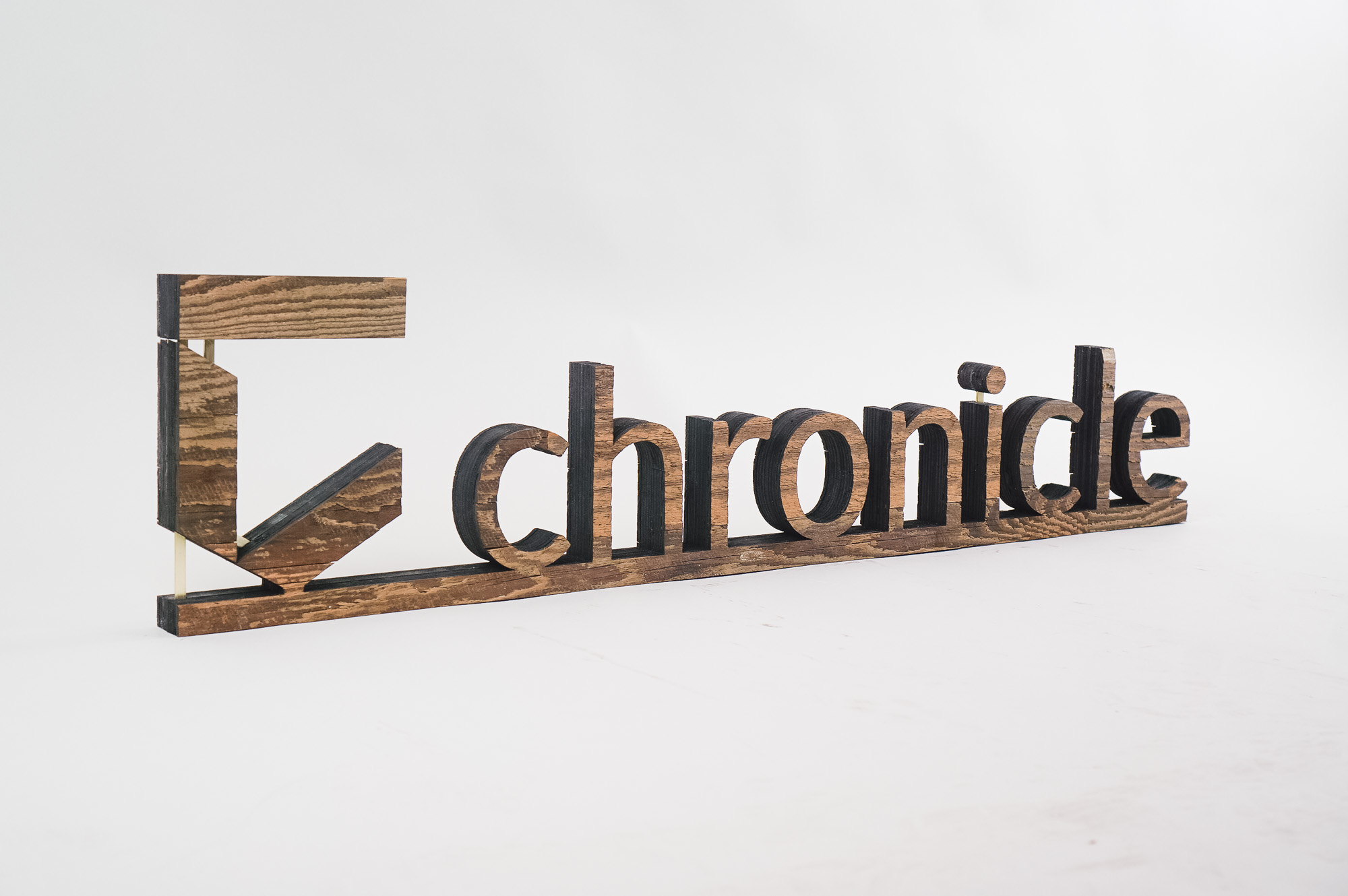 Rustic wood freestanding tabletop logo and letters for a sales conference for Chronicle Security, a cybersecurity company based in Mountain View, California. Rustic wood freestanding tabletop logo and letters for a sales conference for Chronicle Security, a cybersecurity company based in Mountain View, California.