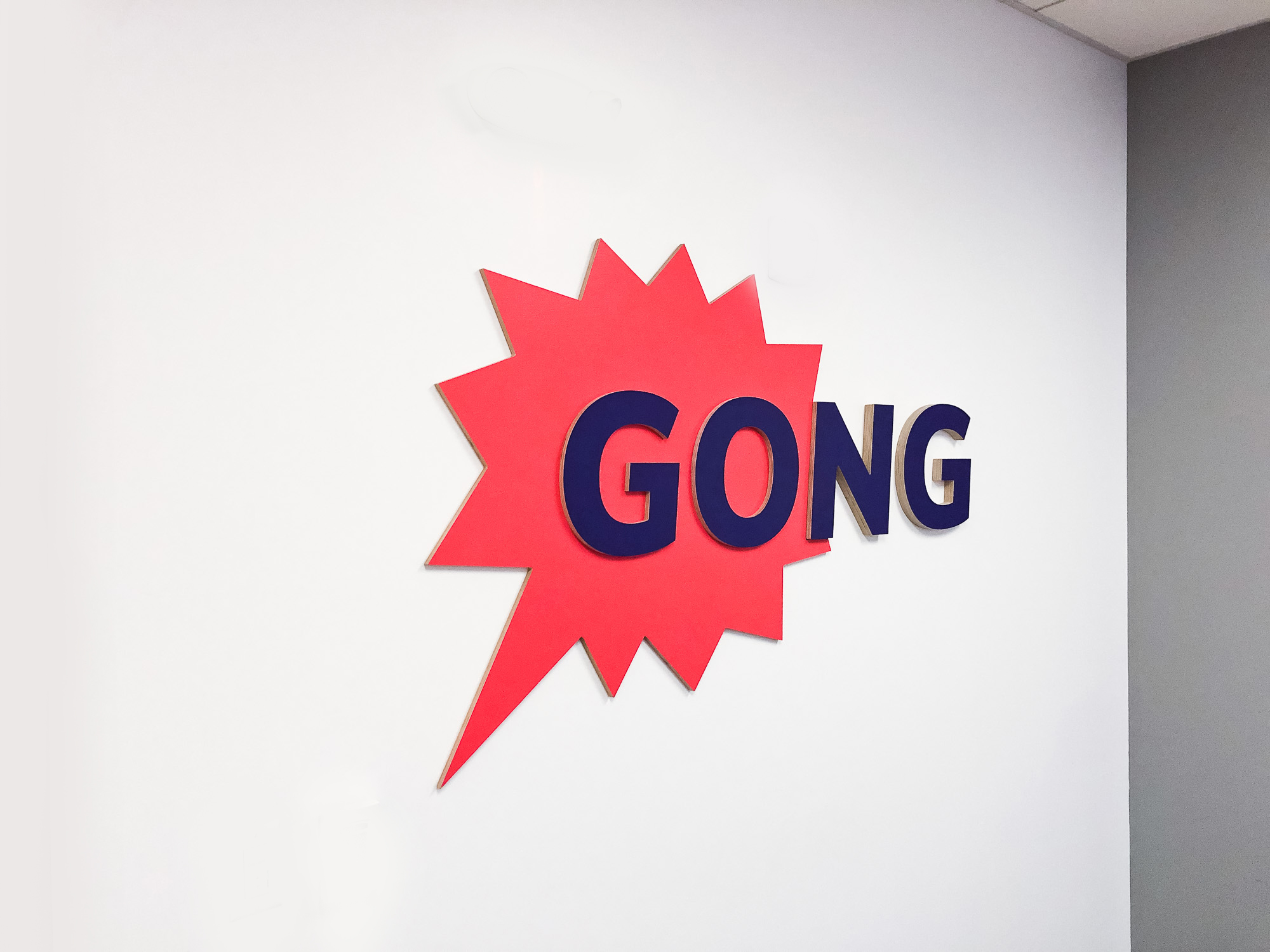 Red and purple painted sign for the San Francisco office of Gong, makers of a conversation intelligence platform for sales. Red and purple painted sign for the San Francisco office of Gong, makers of a conversation intelligence platform for sales.