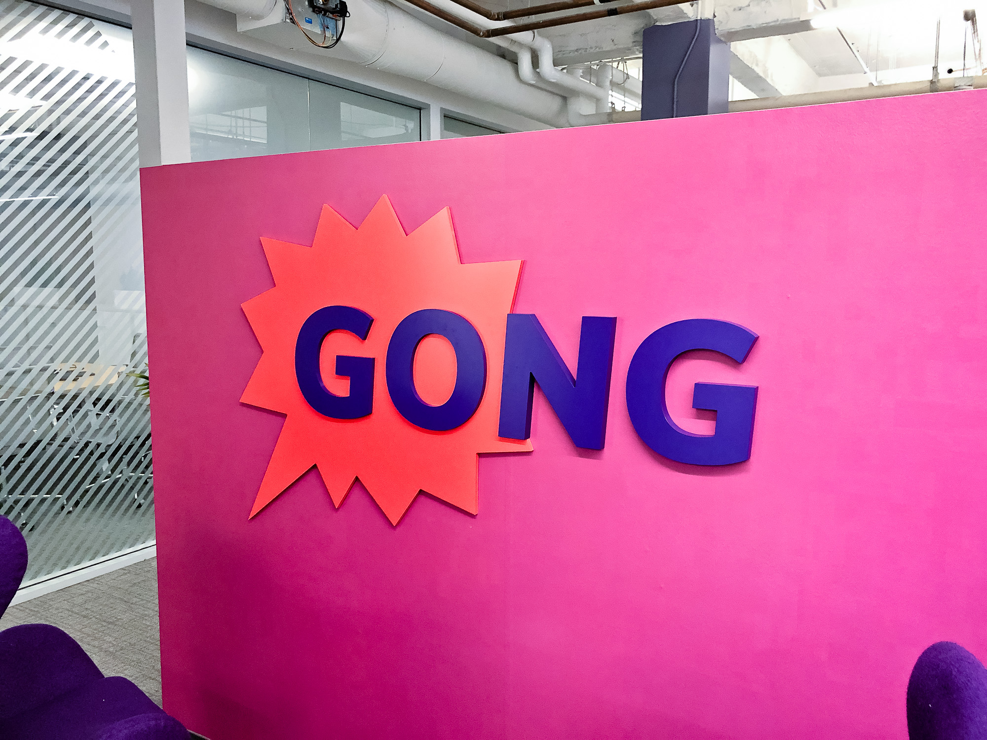 Red and purple painted sign for the San Francisco lobby of Gong, makers of a conversation intelligence platform for sales. Red and purple painted sign for the San Francisco lobby of Gong, makers of a conversation intelligence platform for sales.