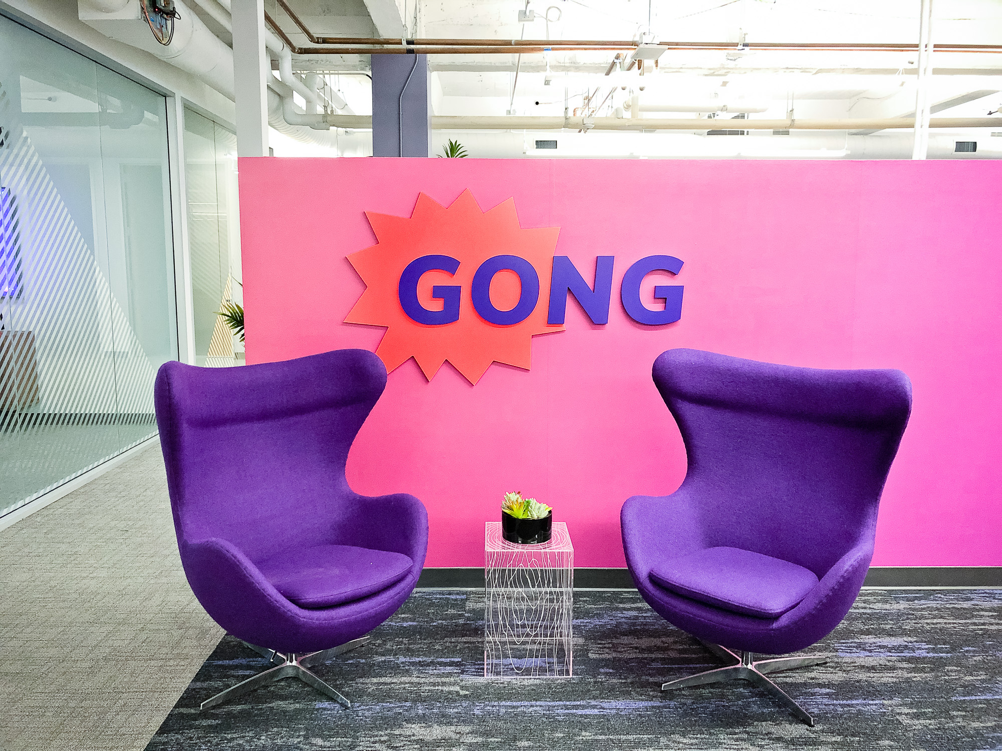 Red and purple painted sign for the San Francisco lobby of Gong, makers of a conversation intelligence platform for sales. Red and purple painted sign for the San Francisco lobby of Gong, makers of a conversation intelligence platform for sales.