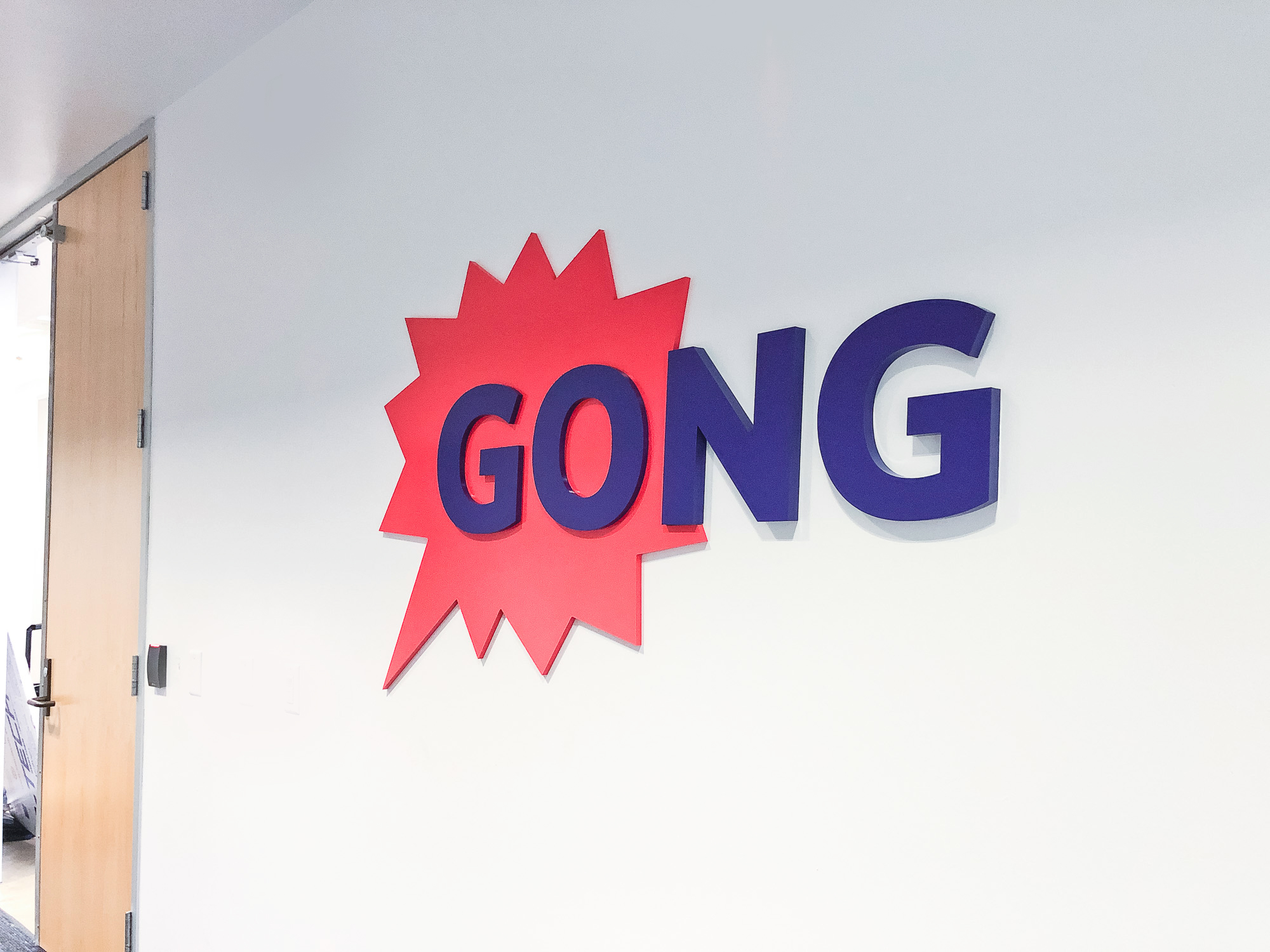 Red and purple painted sign for the San Francisco office of Gong, makers of a conversation intelligence platform for sales. Red and purple painted sign for the San Francisco office of Gong, makers of a conversation intelligence platform for sales.