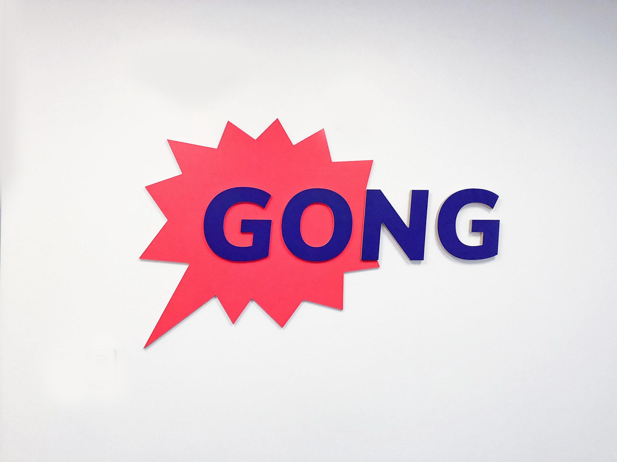 Red and purple painted sign for the San Francisco office of Gong, makers of a conversation intelligence platform for sales. Red and purple painted sign for the San Francisco office of Gong, makers of a conversation intelligence platform for sales.