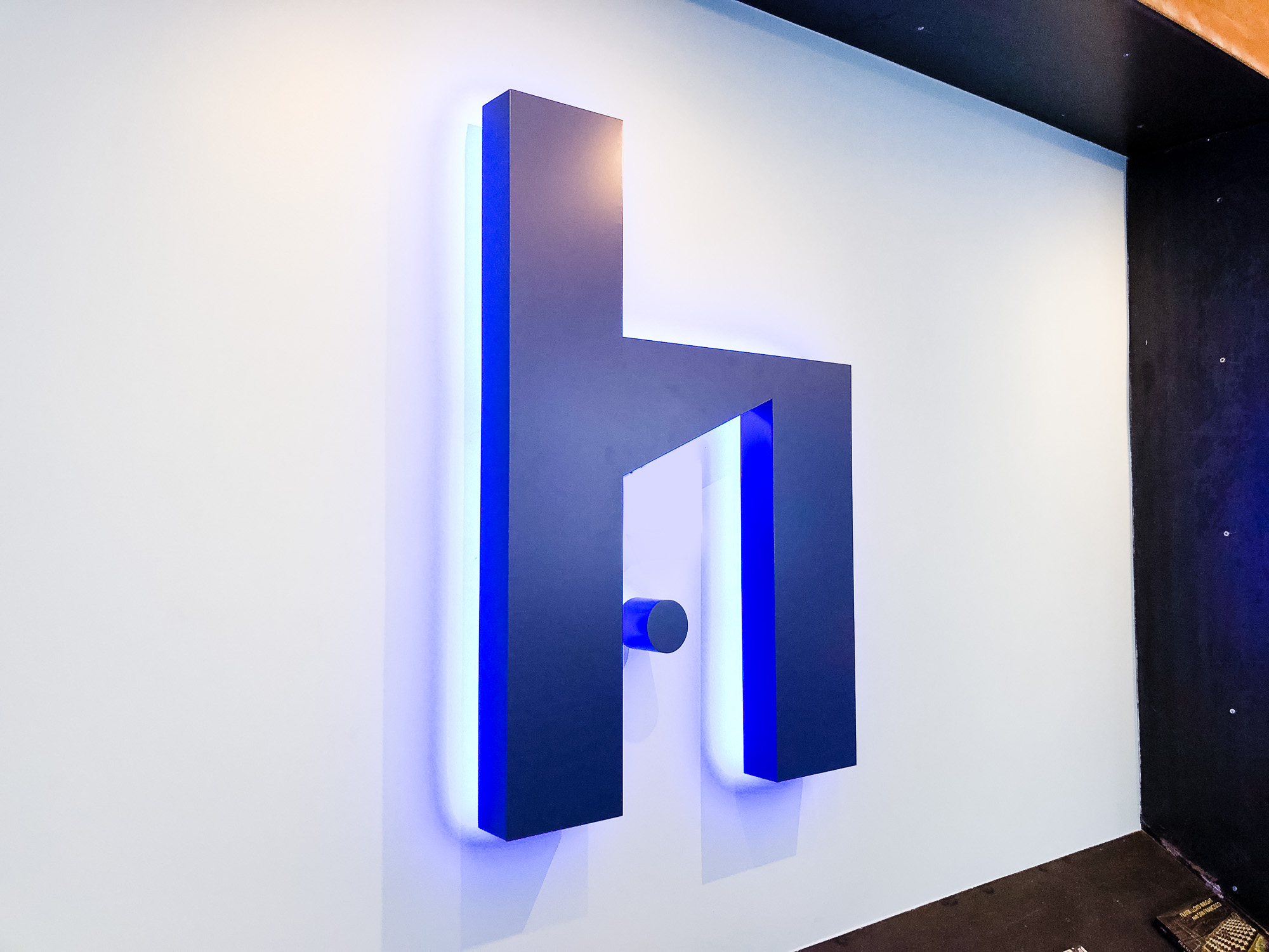 Blue painted, halo-lit, illuminated sign for HelloOffice, a San Francisco technology-powered commercial real estate brokerage helping companies search for office space.