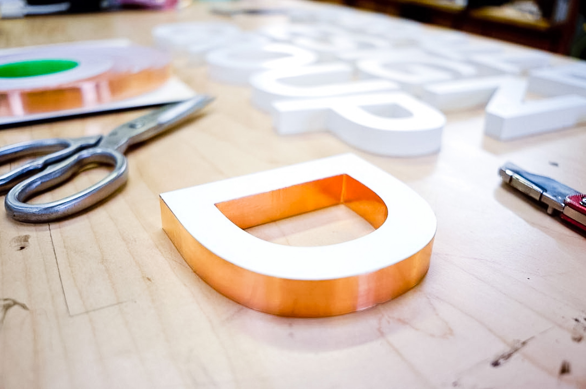 White letters with copper edges for Parallel Design Group, a commercial interior design firm based in Indianapolis, IN. White letters with copper edges for Parallel Design Group, a commercial interior design firm based in Indianapolis, IN.