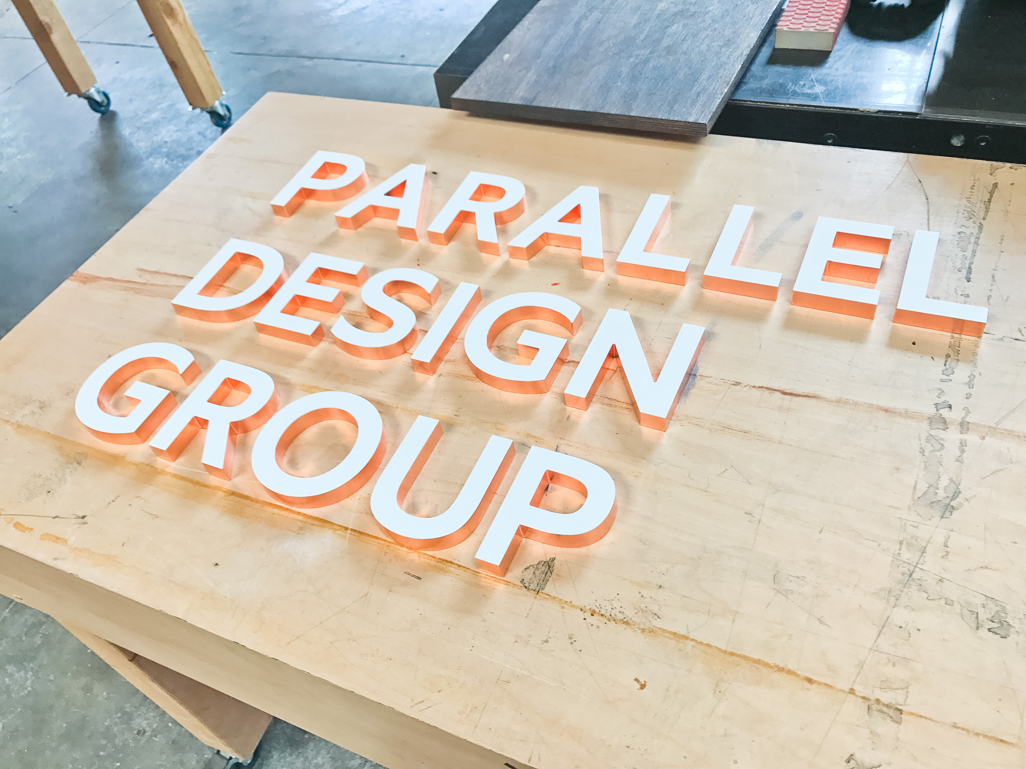 White letters with copper edges for Parallel Design Group, a commercial interior design firm based in Indianapolis, IN. White letters with copper edges for Parallel Design Group, a commercial interior design firm based in Indianapolis, IN.