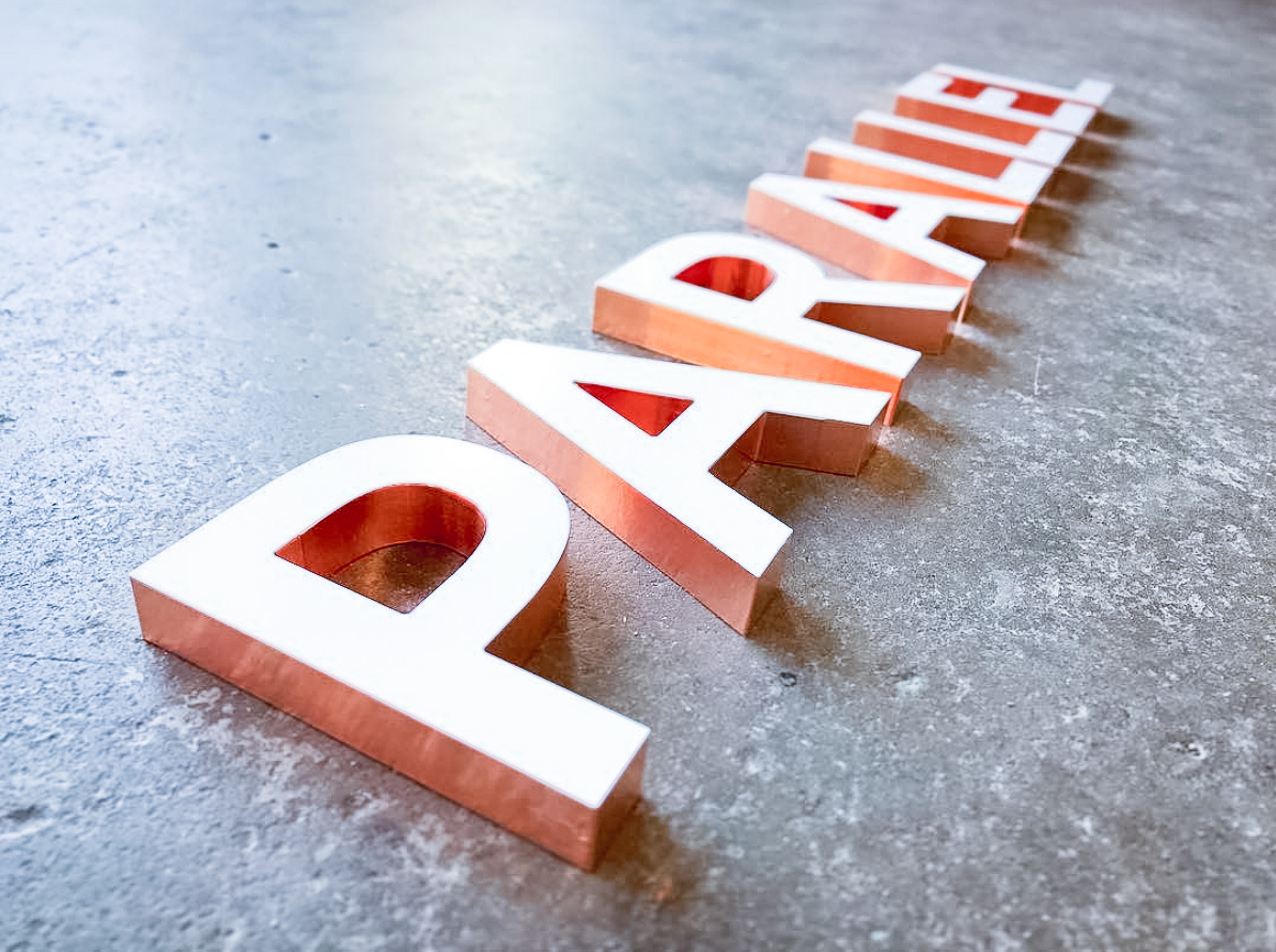 White letters with copper edges for Parallel Design Group, a commercial interior design firm based in Indianapolis, IN. White letters with copper edges for Parallel Design Group, a commercial interior design firm based in Indianapolis, IN.