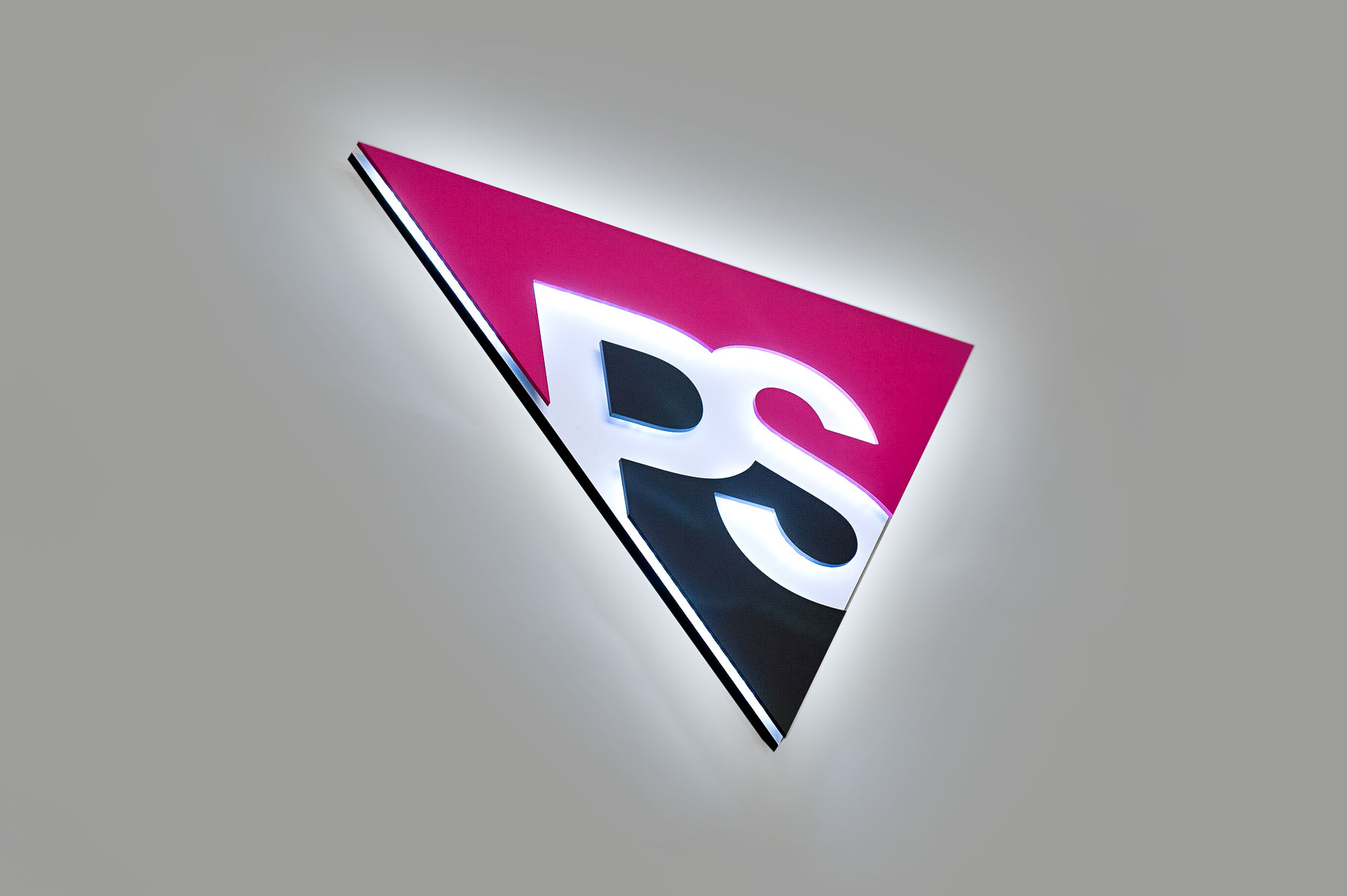 Illuminated pink and grey entrance sign for Peer Seattle, a gay and lesbian organization in Seattle, Washington