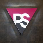 Illuminated pink and grey entrance sign for Peer Seattle, a gay and lesbian organization in Seattle, Washington