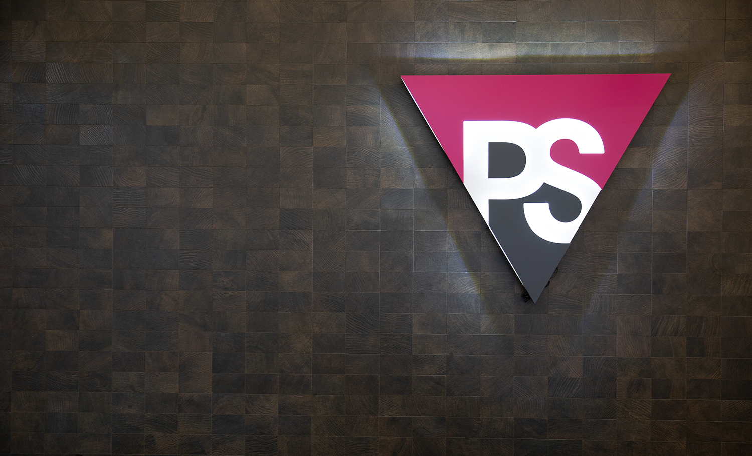 Illuminated pink and grey entrance sign for Peer Seattle, a gay and lesbian organization in Seattle, Washington