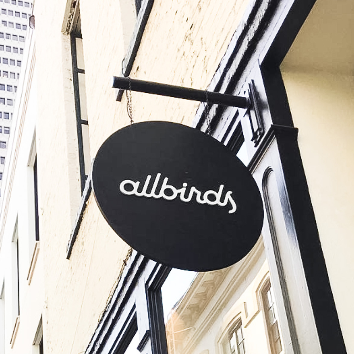 Black round blade sign with white script text for Allbirds, a San Francisco-based direct-to-consumer startup aimed at designing environmentally friendly footwear. Black round blade sign with white script text for Allbirds, a San Francisco-based direct-to-consumer startup aimed at designing environmentally friendly footwear.