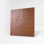 Metallic copper painted acrylic and dark wood outdoor sign for Beacon