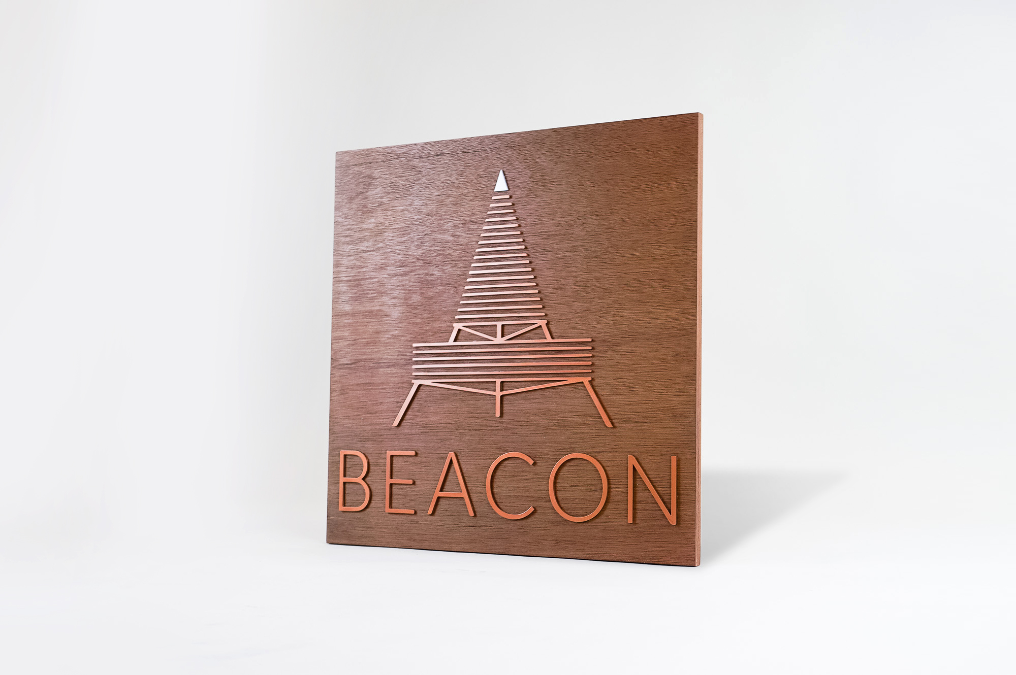Metallic copper painted acrylic and dark wood outdoor sign for Beacon Metallic copper painted acrylic and dark wood outdoor sign for Beacon