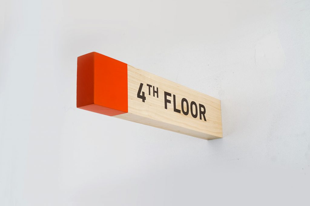 Overhead wood wayfinding signs for Biolite, a New York City based startup that develops and manufactures off-grid energy products for both the outdoor recreational industry and emerging markets.