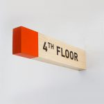 Overhead wood wayfinding signs for Biolite, a New York City based startup that develops and manufactures off-grid energy products for both the outdoor recreational industry and emerging markets.
