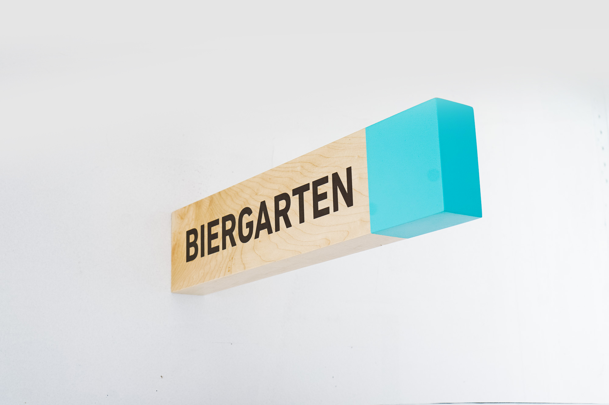 Overhead wood wayfinding signs for Biolite, a New York City based startup that develops and manufactures off-grid energy products for both the outdoor recreational industry and emerging markets.