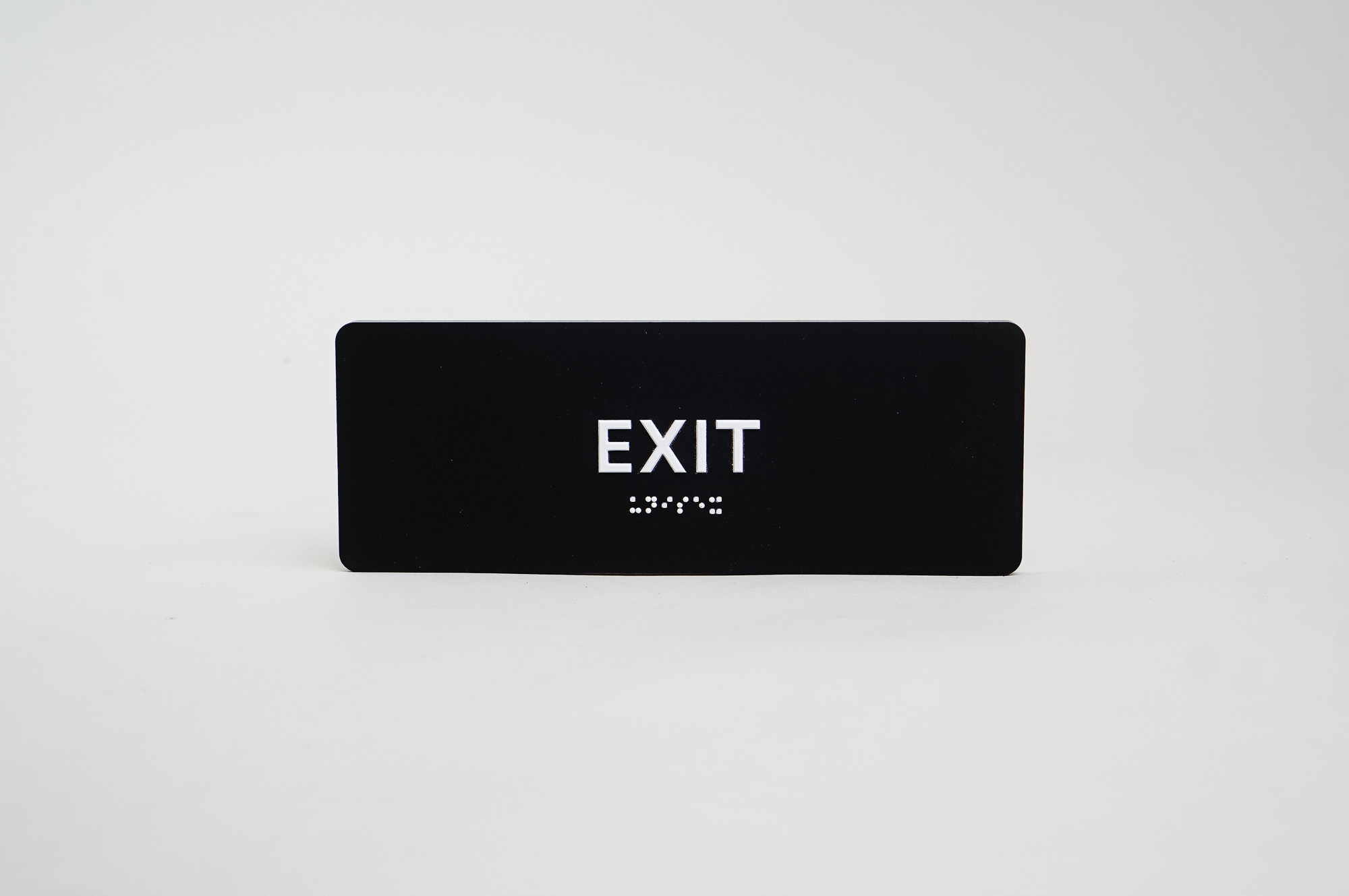 Modern black and white ADA exit sign