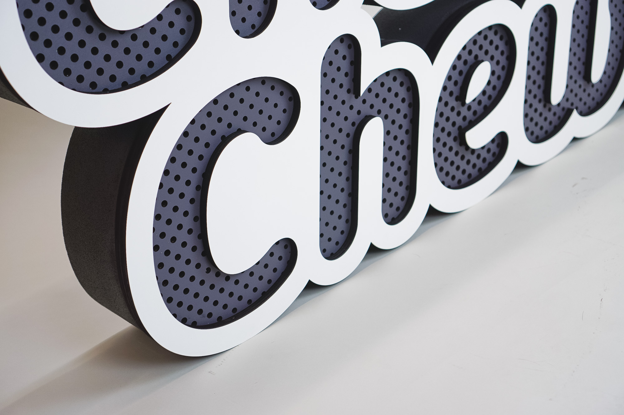 Dimensional large grey and white freestanding tradeshow floor sign for Cheeba Chews, makers of cannabis-infused edibles.