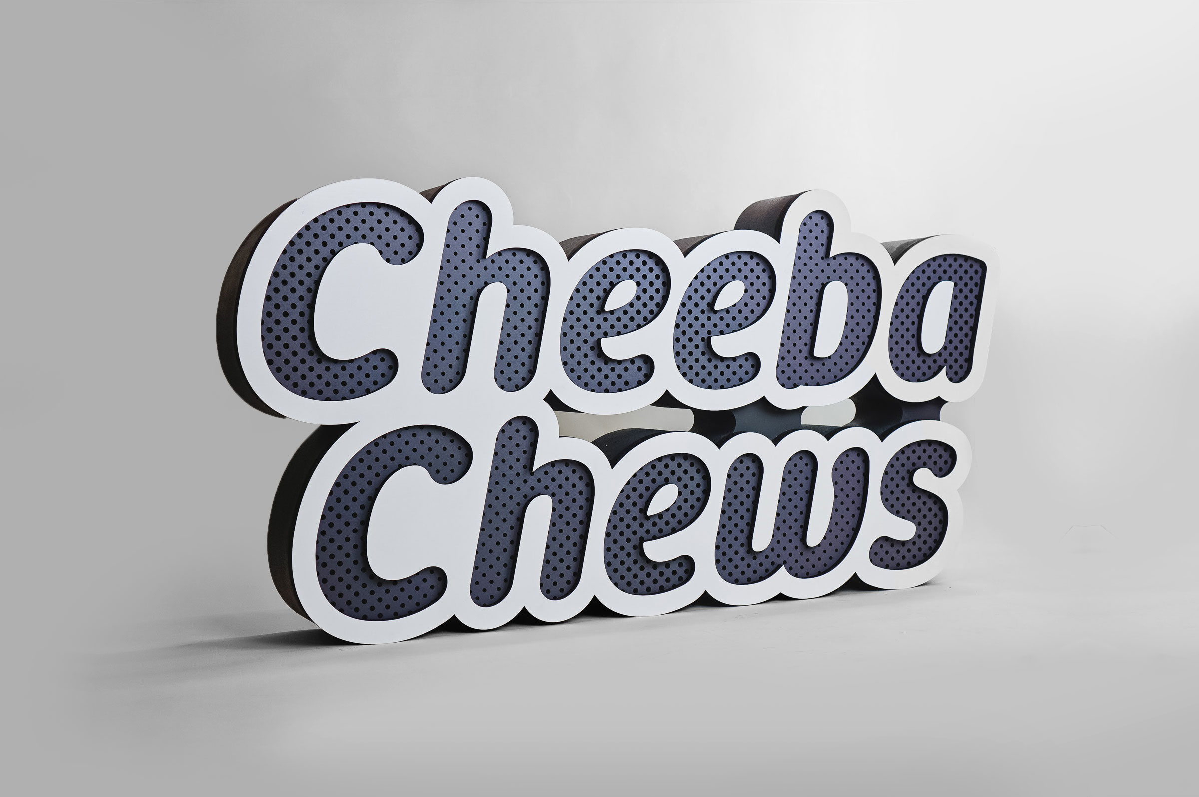 Dimensional large grey and white freestanding tradeshow floor sign for Cheeba Chews, makers of cannabis-infused edibles.
