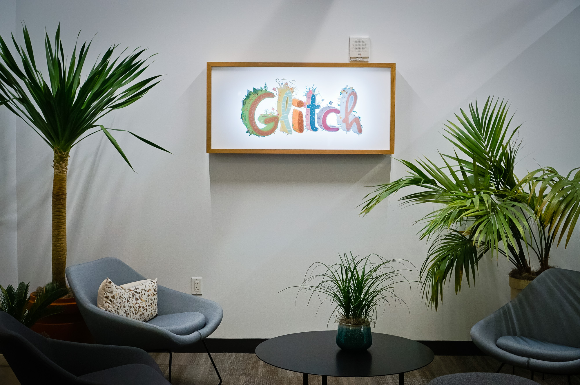 Backprinted full color lightbox sign with wood frame for Glitch, a browser-based, massively multiplayer online game—eventually becoming Slack.