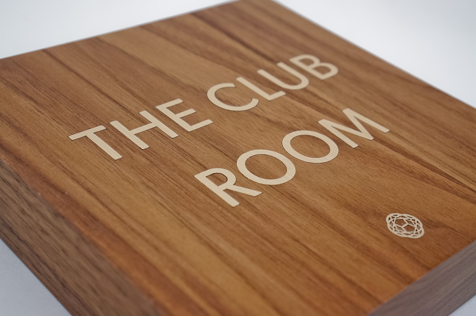 Vintage walnut and inlaid-brass style sign for Nexus Club, a private social and business club in New York. Vintage walnut and inlaid-brass style sign for Nexus Club, a private social and business club in New York.