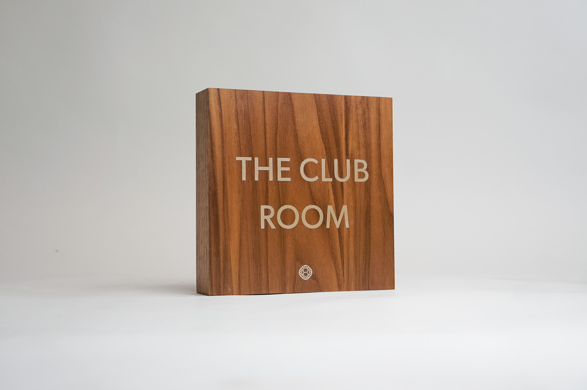 Vintage walnut and inlaid-brass style sign for Nexus Club, a private social and business club in New York. Vintage walnut and inlaid-brass style sign for Nexus Club, a private social and business club in New York.