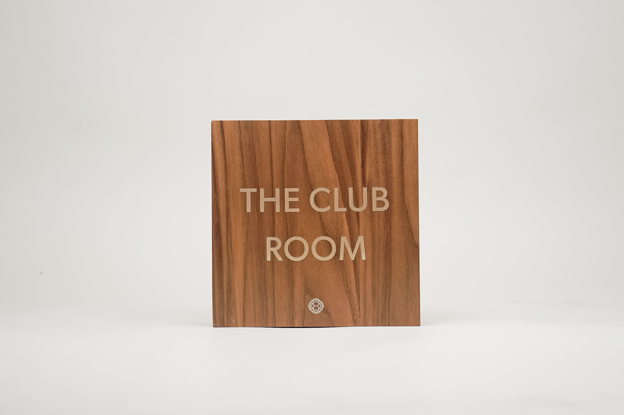 Vintage walnut and inlaid-brass style sign for Nexus Club, a private social and business club in New York. Vintage walnut and inlaid-brass style sign for Nexus Club, a private social and business club in New York.