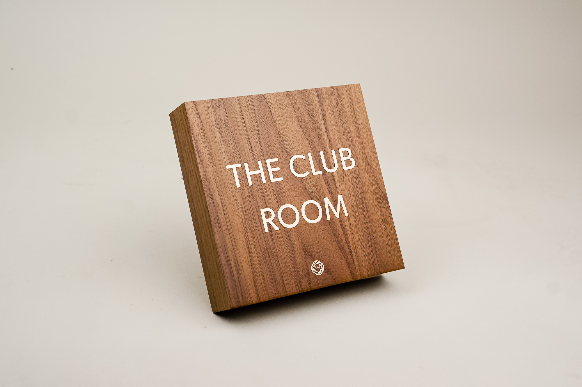 Vintage walnut and inlaid-brass style sign for Nexus Club, a private social and business club in New York. Vintage walnut and inlaid-brass style sign for Nexus Club, a private social and business club in New York.