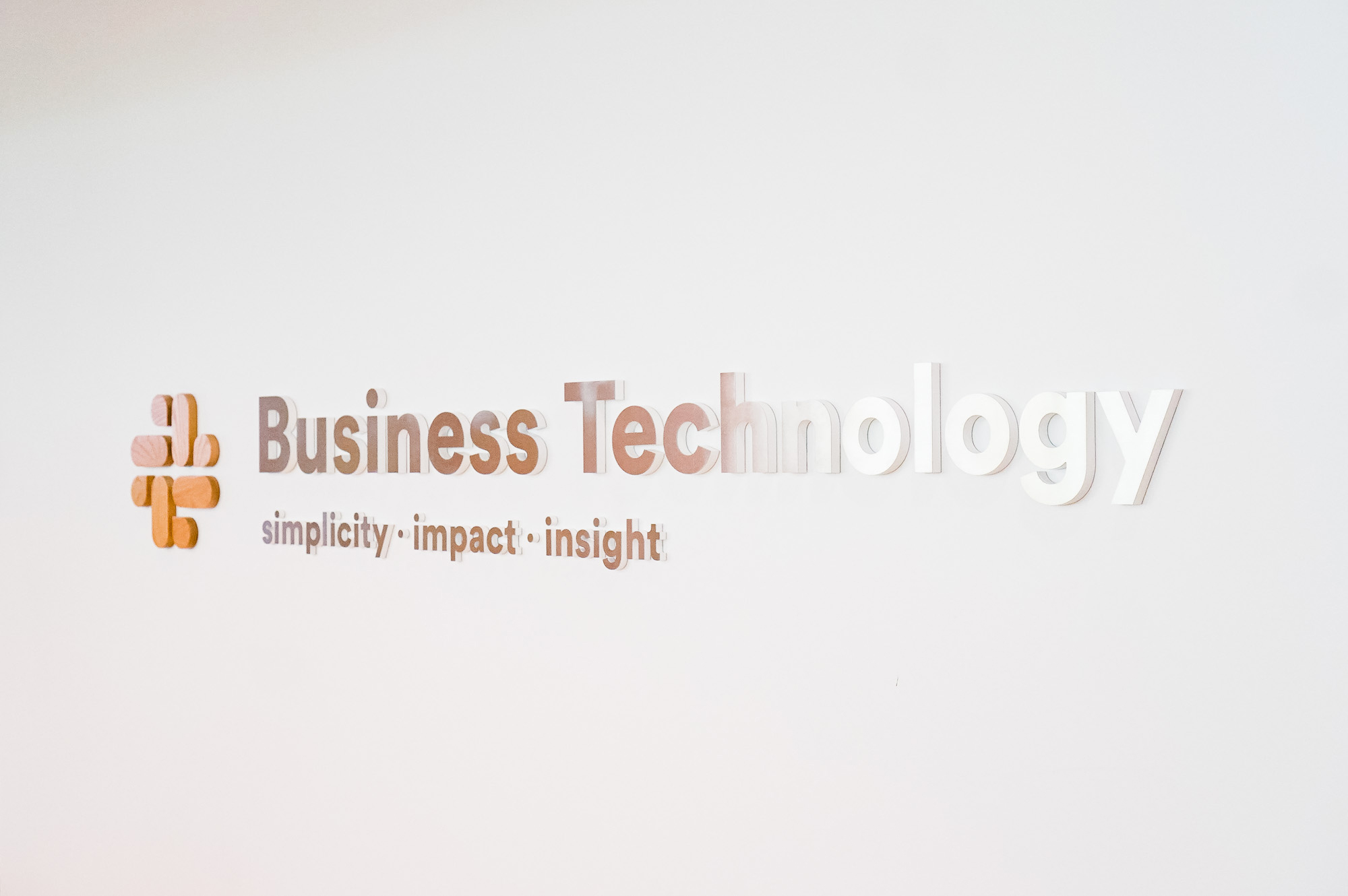 Wood and metal sign for the Business Technology department at Slack, an American cloud-based set of team collaboration tools and services. Wood and metal sign for the Business Technology department at Slack, an American cloud-based set of team collaboration tools and services.