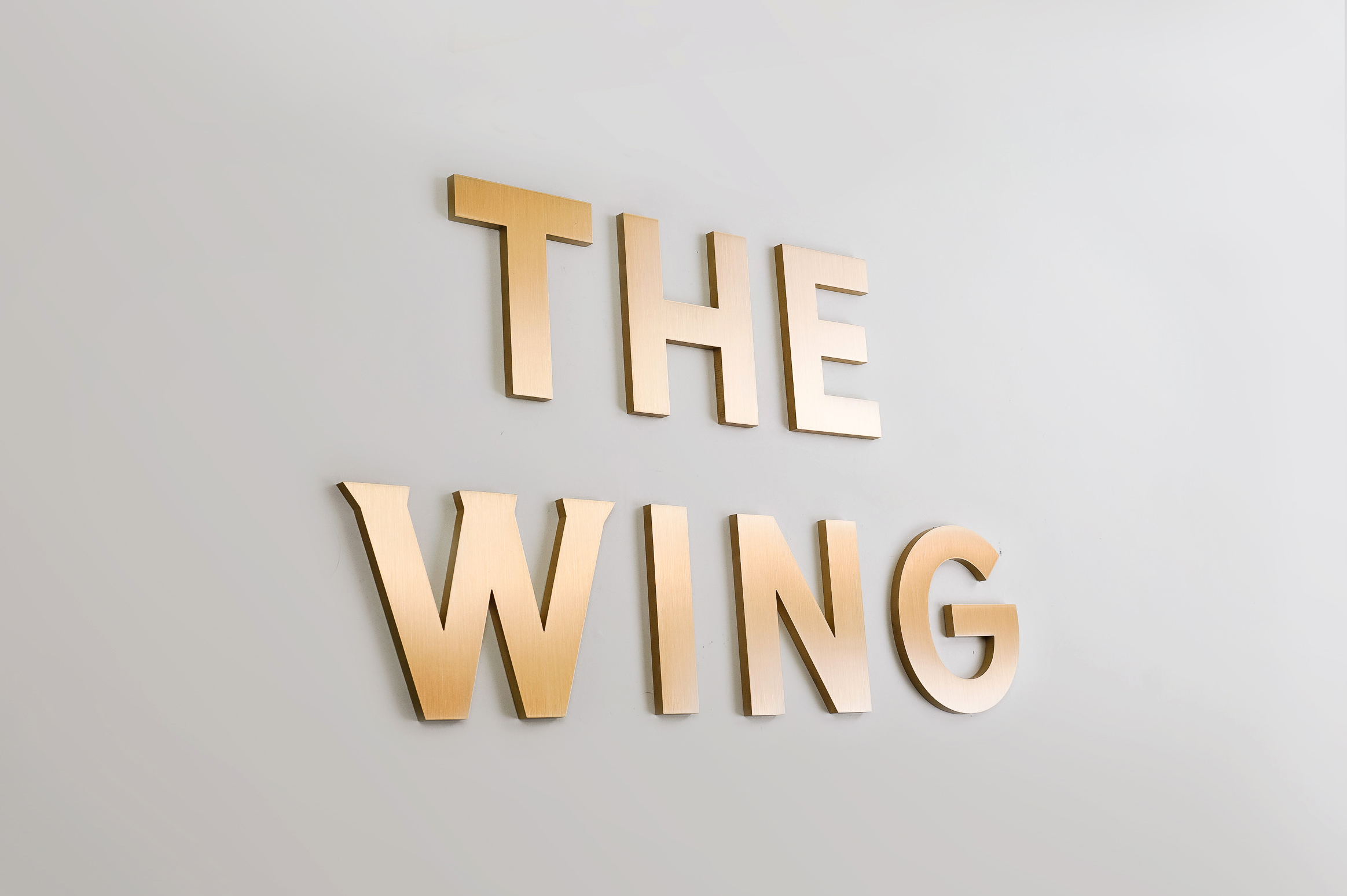 Retro, brass colored sign made from brushed, solid bronze for The Wing, a co-working space in Los Angeles. Retro, brass colored sign made from brushed, solid bronze for The Wing, a co-working space in Los Angeles.
