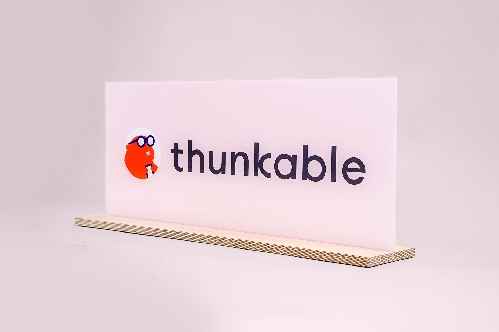 Glass-like, pink freestanding back printed sign for Thunkable, a cross-platform app builder that enables anyone to build their own native mobile apps. Glass-like, pink freestanding back printed sign for Thunkable, a cross-platform app builder that enables anyone to build their own native mobile apps.