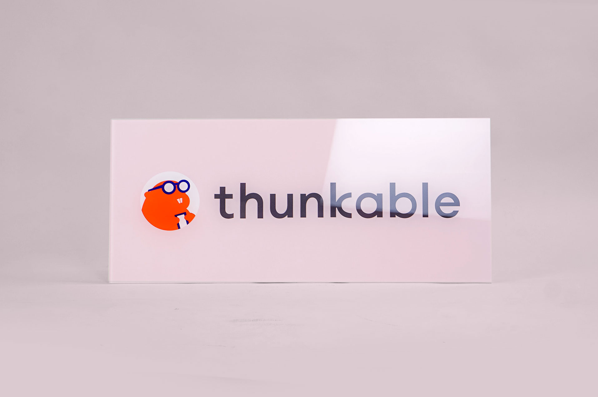 Glass-like, pale pink back printed sign for Thunkable, a cross-platform app builder that enables anyone to build their own native mobile apps. Glass-like, pale pink back printed sign for Thunkable, a cross-platform app builder that enables anyone to build their own native mobile apps.
