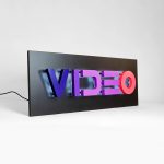 Halo-lit, retro-style, portable "VIDEO" sign with gradient for Facebook, an American online social media and social networking service company.