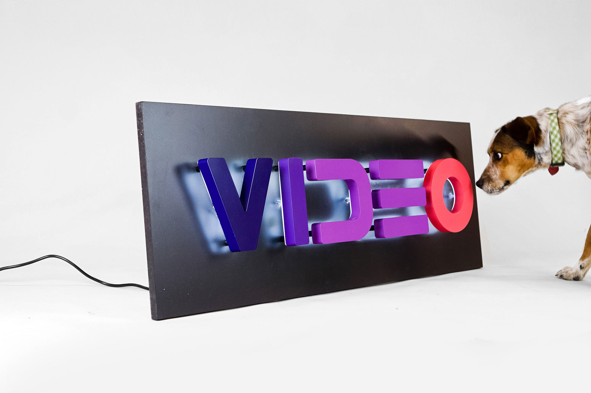Halo-lit, retro-style, portable “VIDEO” sign with gradient for Facebook, an American online social media and social networking service company. Halo-lit, retro-style, portable