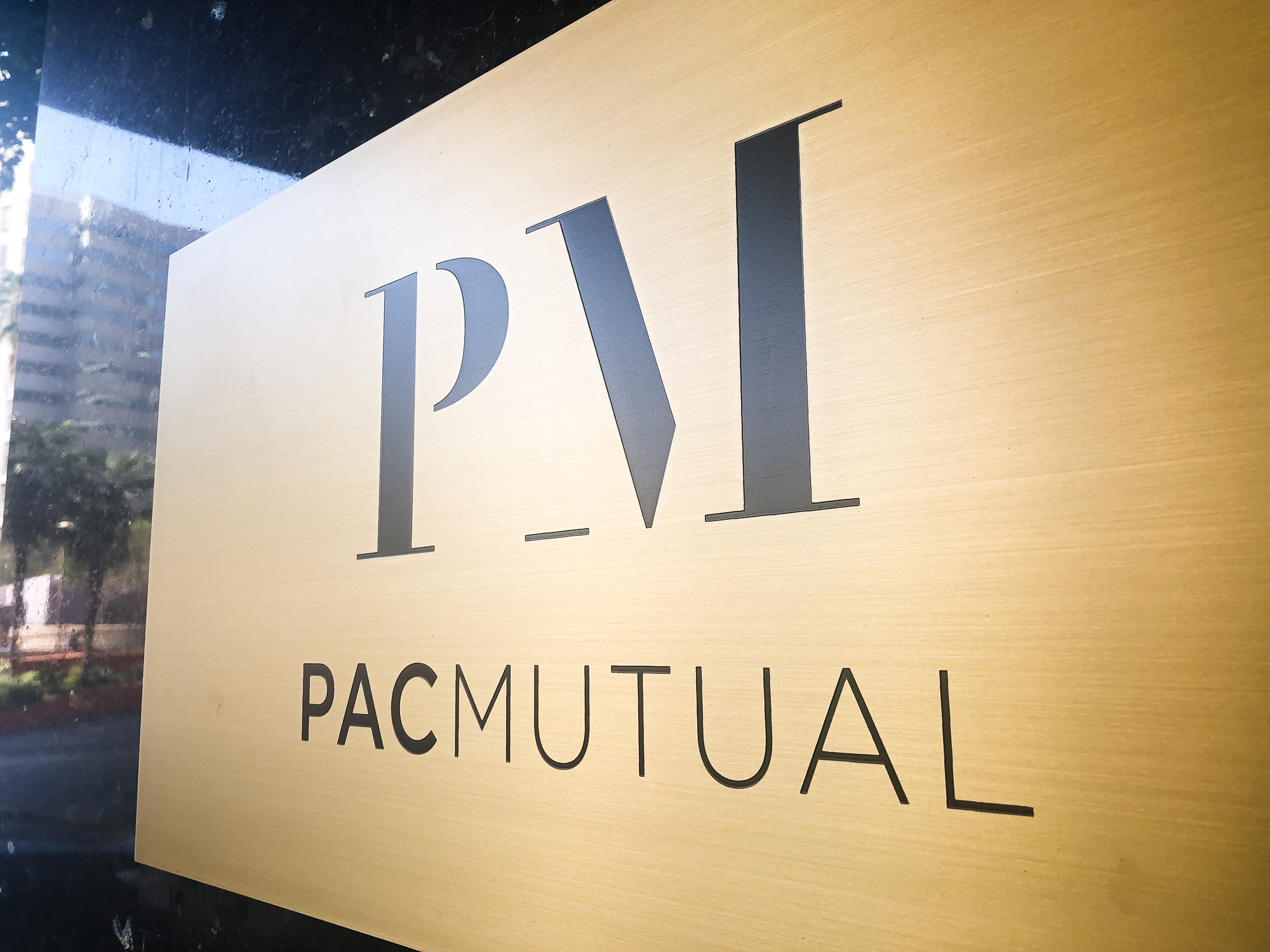 brushed brass panel etched building sign