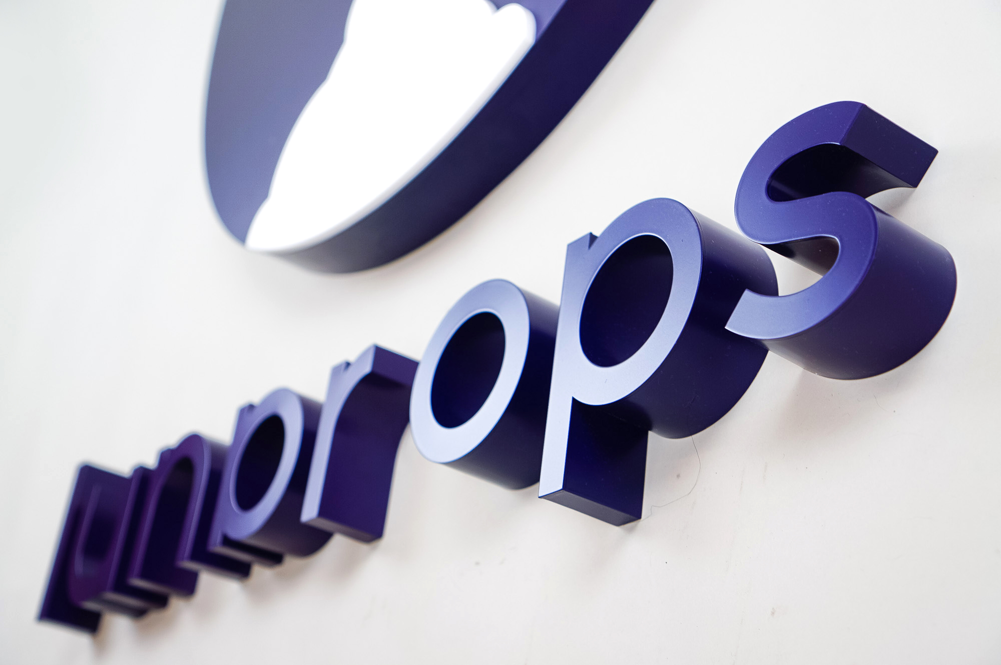 Dimensional purple letters and white rocket ship for Lunar Ops, Inc. in New York. Dimensional purple letters and white rocket ship for Lunar Ops, Inc. in New York.