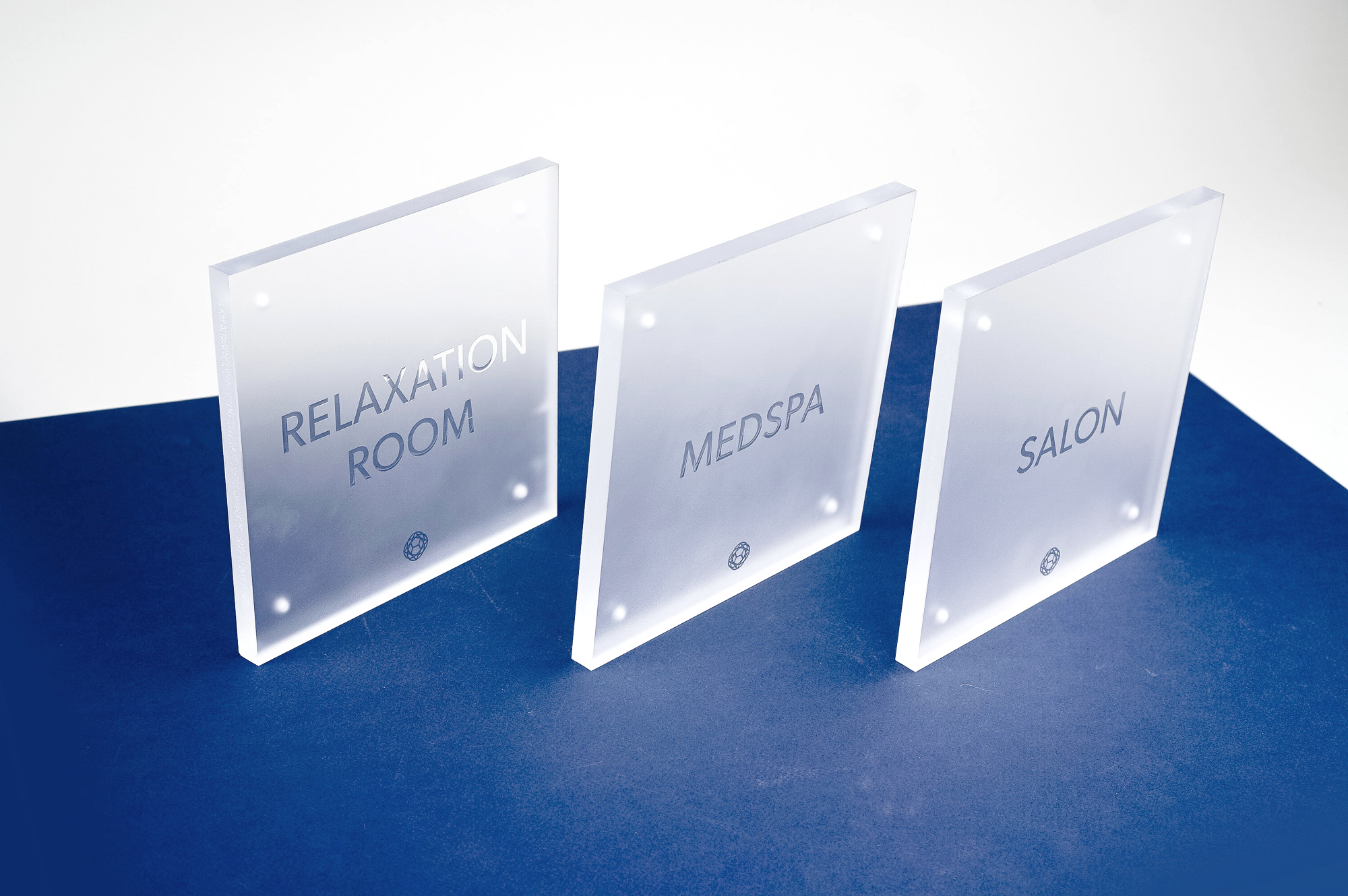 Frosted room sign with glossy clear ink for Nexus Club, Nexus Club, a private social and business club in New York.