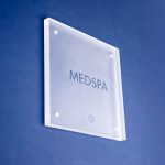 Frosted room sign with glossy clear ink for Nexus Club, Nexus Club, a private social and business club in New York.