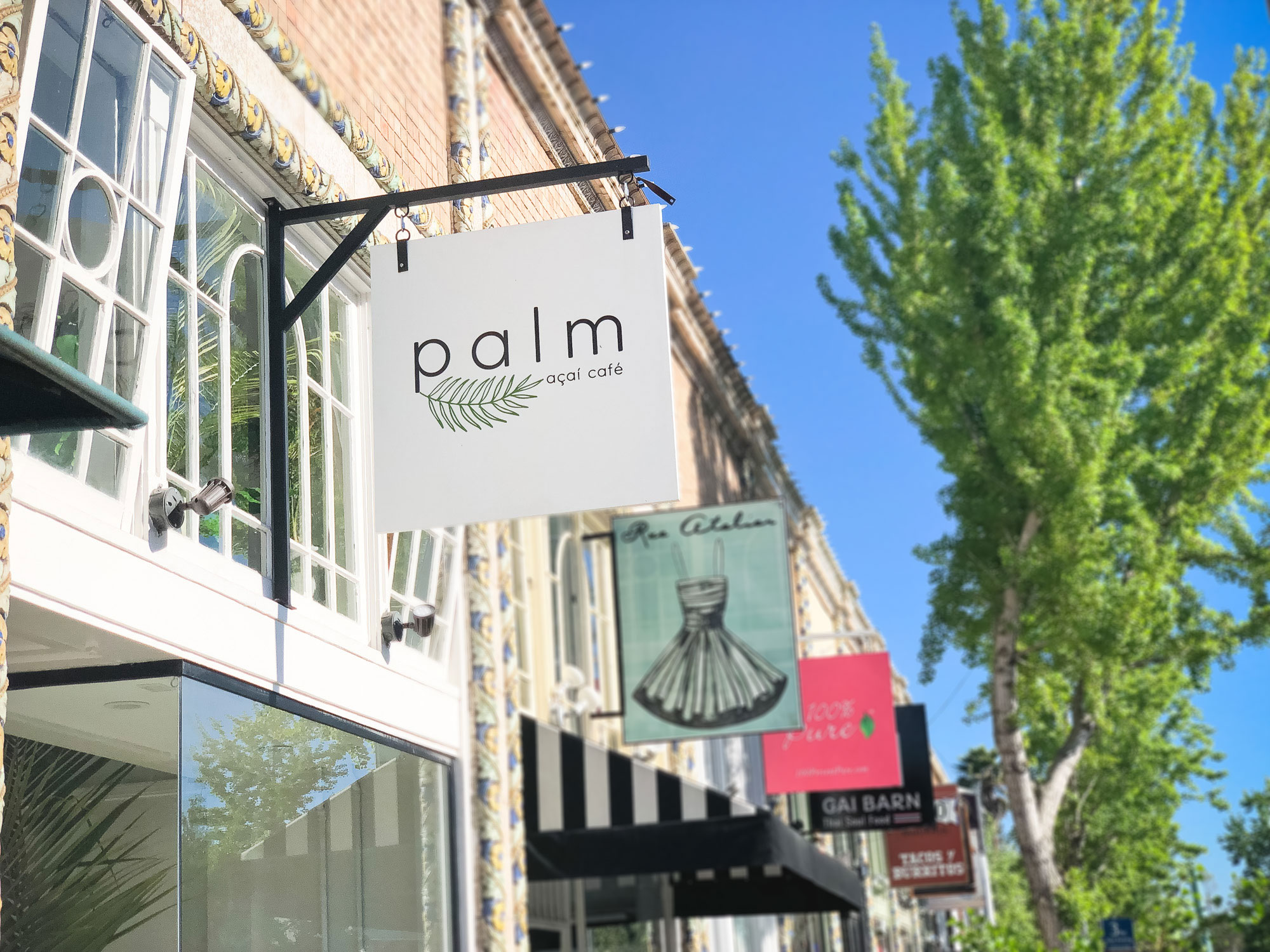 Simple white blade sign for palm acai cafe in Oakland, CA Simple white blade sign for palm acai cafe in Oakland, CA