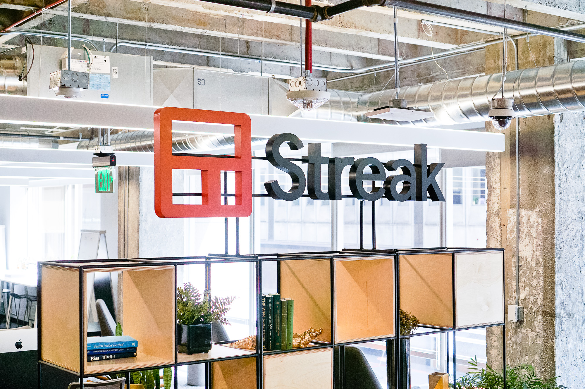 Freestanding cutout logo on a shelf at the entrance of Streak, a San Francisco based relationship management platform for Gmail.