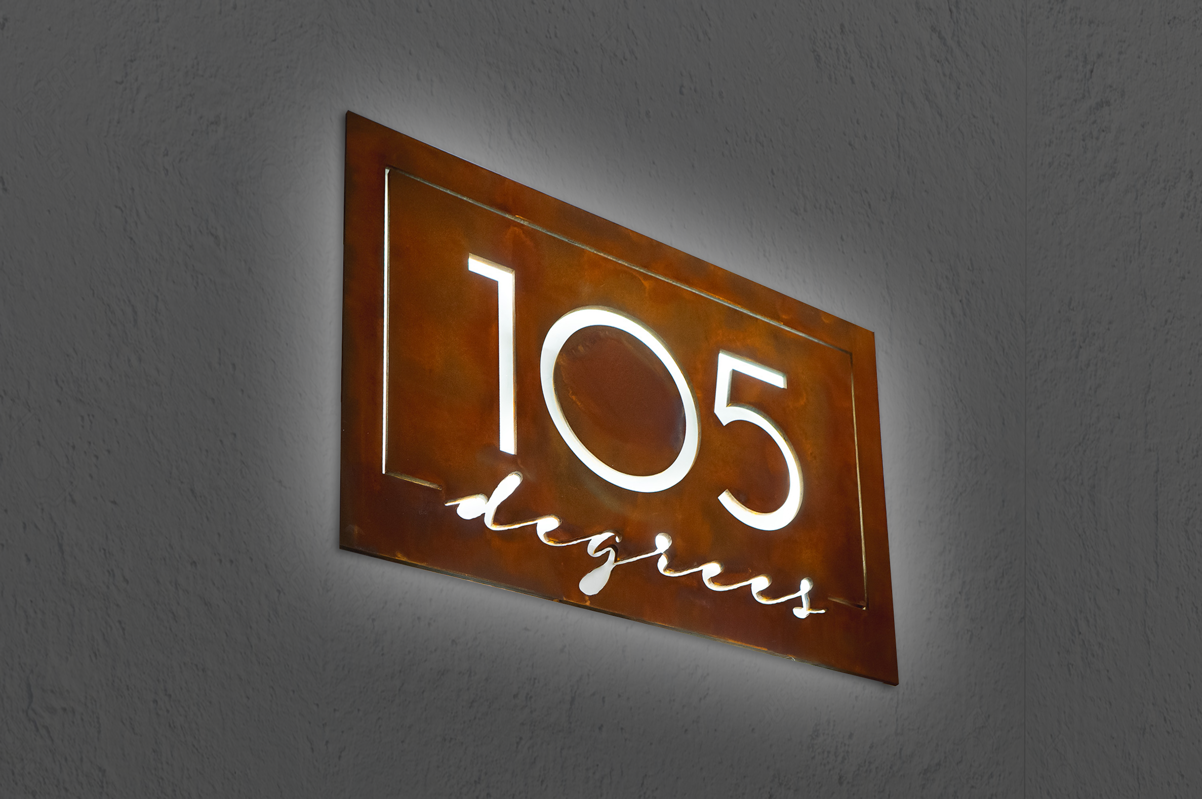 Rusted metal illuminated sign for 105 Degrees, a hot yoga studio at Newtown Athletic Club, a premiere family fitness and wellness center serving residents of Newtown, PA
