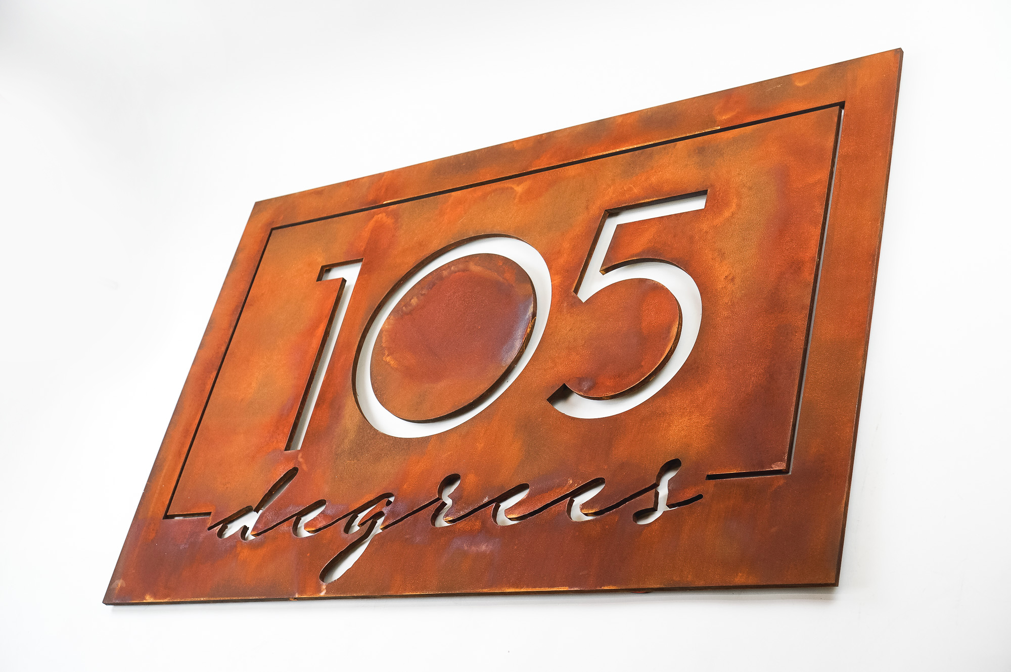Rusted metal illuminated sign for 105 Degrees, a hot yoga studio at Newtown Athletic Club, a premiere family fitness and wellness center serving residents of Newtown, PA Rusted metal illuminated sign for 105 Degrees, a hot yoga studio at Newtown Athletic Club, a premiere family fitness and wellness center serving residents of Newtown, PA