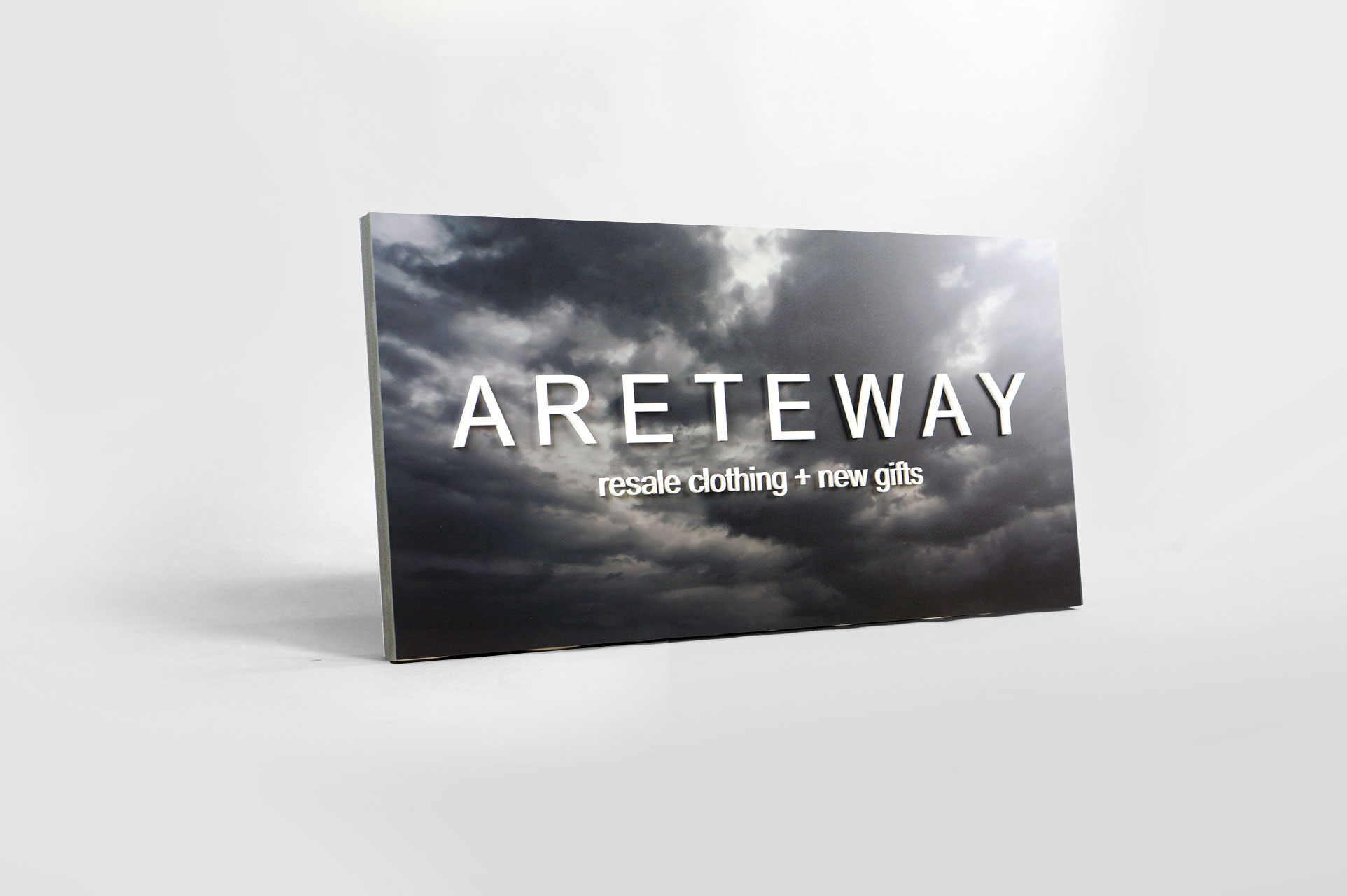 Exterior sign with black and white photo and raised white letters for Areteway, a clothing and gift boutique in Santa Rosa, CA. Exterior sign with black and white photo and raised white letters for Areteway, a clothing and gift boutique in Santa Rosa, CA.
