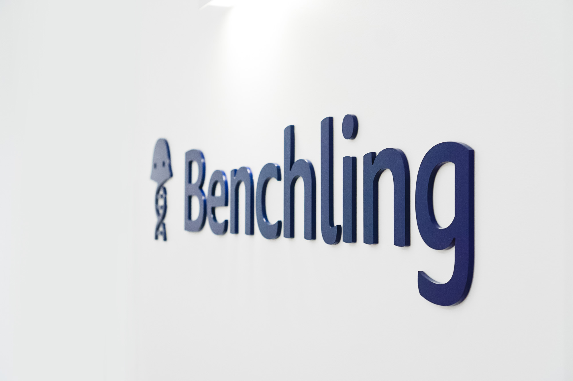 Navy blue sign on white wall in the elevator vestibule of Benchling, a San Francisco based company working on a unified platform to accelerate, measure, and forecast R&D from discovery through bioprocessing. Navy blue sign on white wall in the elevator vestibule of Benchling, a San Francisco based company working on a unified platform to accelerate, measure, and forecast R&D from discovery through bioprocessing.